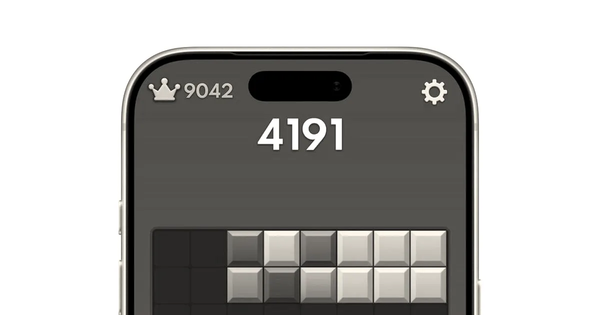 A smartphone screen displaying gameplay of the block puzzle game Block Blast with colorful geometric tiles.