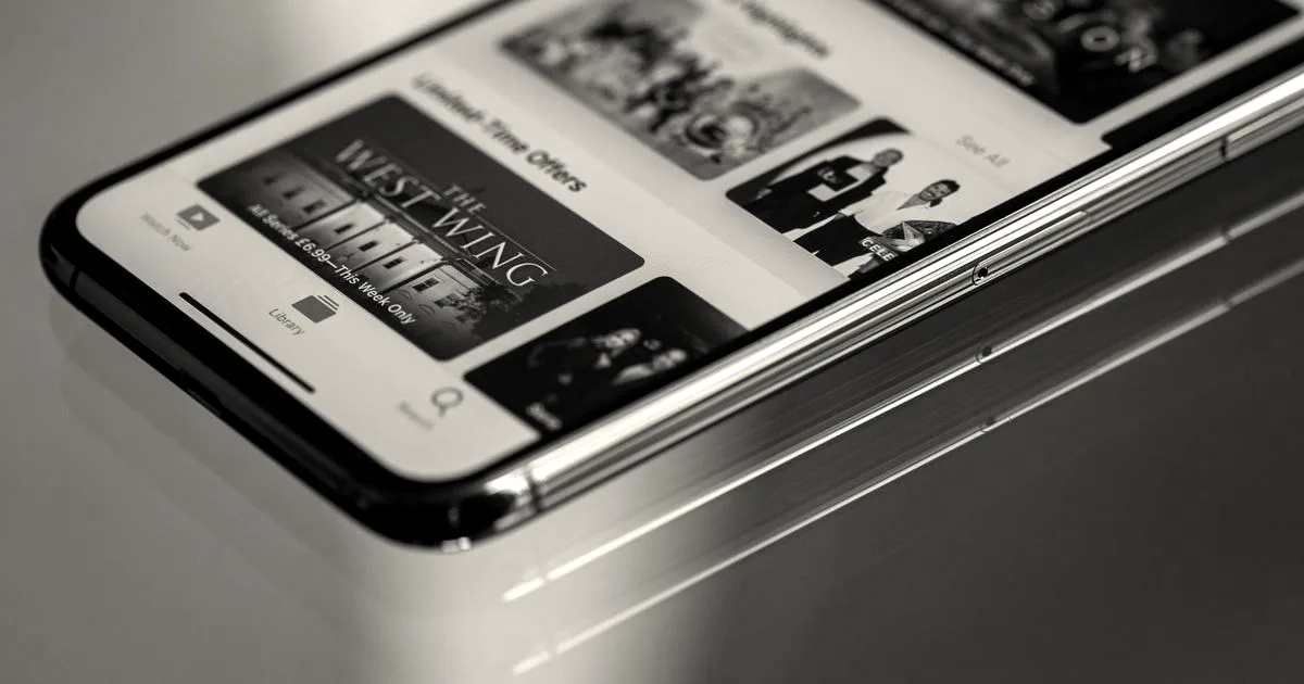 Close-up view of a smartphone featuring a streaming service interface, highlighting technology in modern entertainment.
