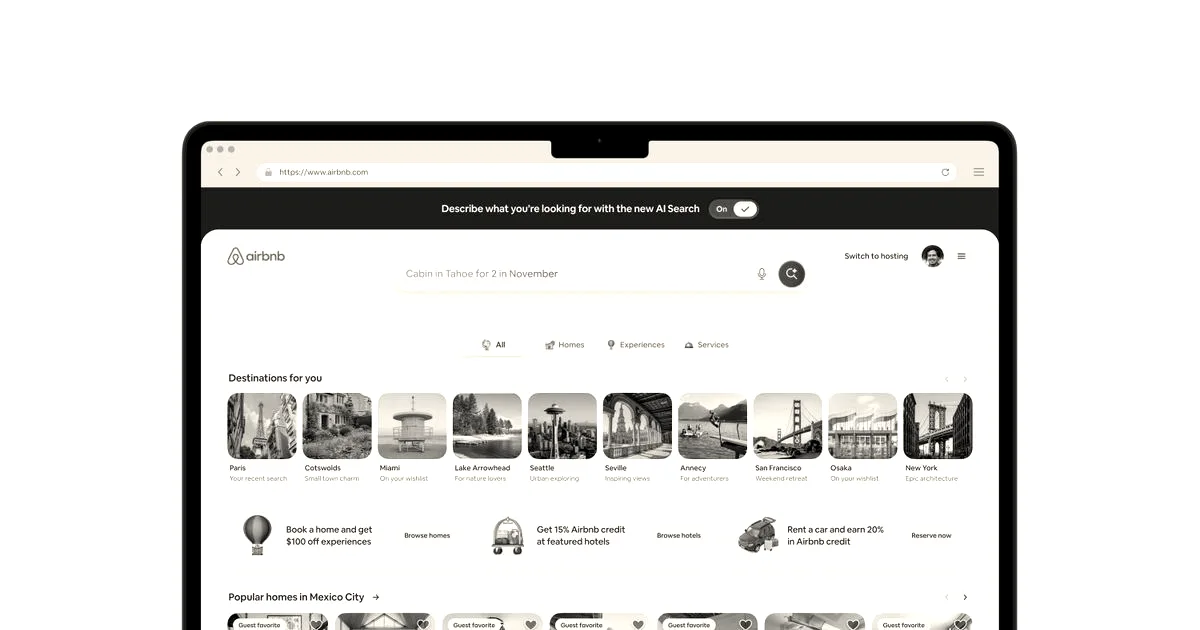 A laptop screen displaying Airbnb's homepage featuring new AI search capabilities and curated travel destinations.