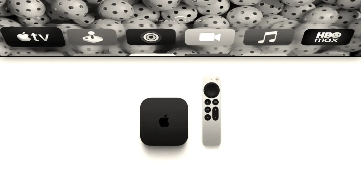 An Apple TV 4K console and Siri Remote displayed below a television screen showing the tvOS interface.