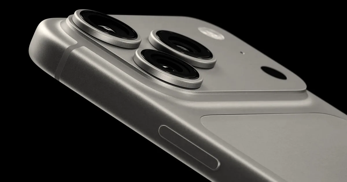 Close-up angled shot of the triple-lens camera module and sleek blue chassis of the new iPhone.