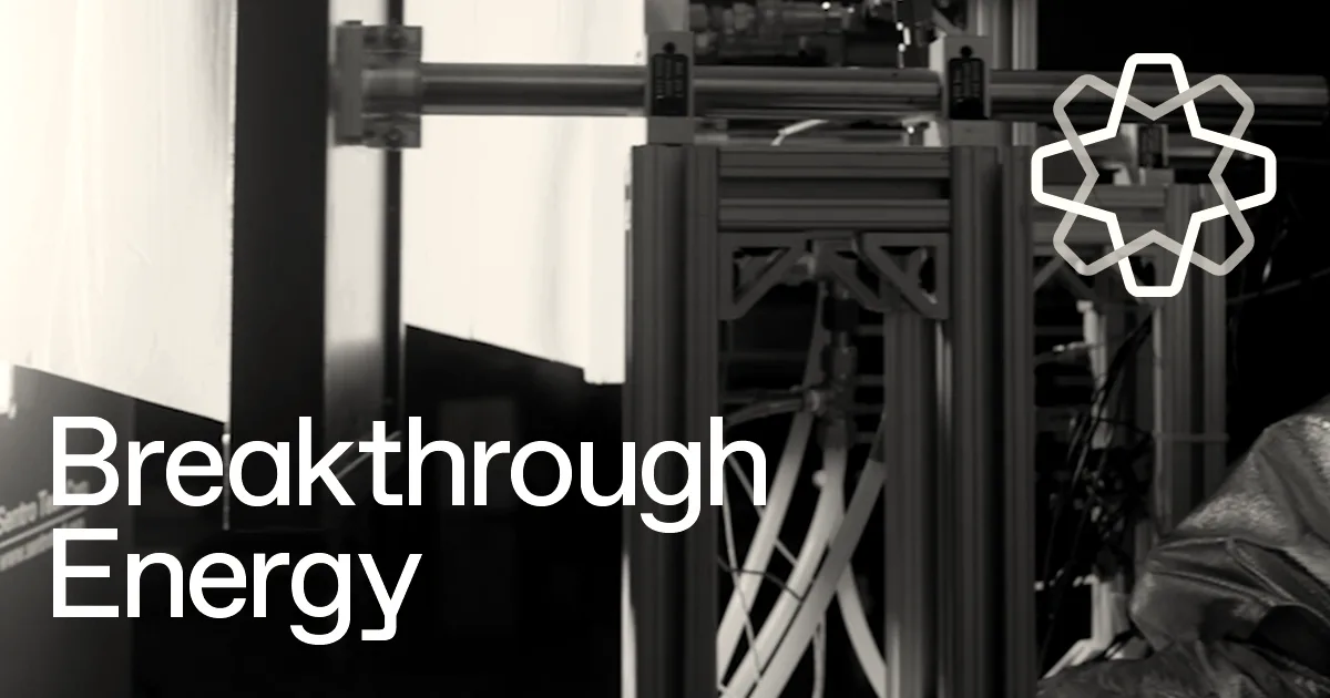 Breakthrough Energy logo and text overlaying a dark industrial laboratory environment.