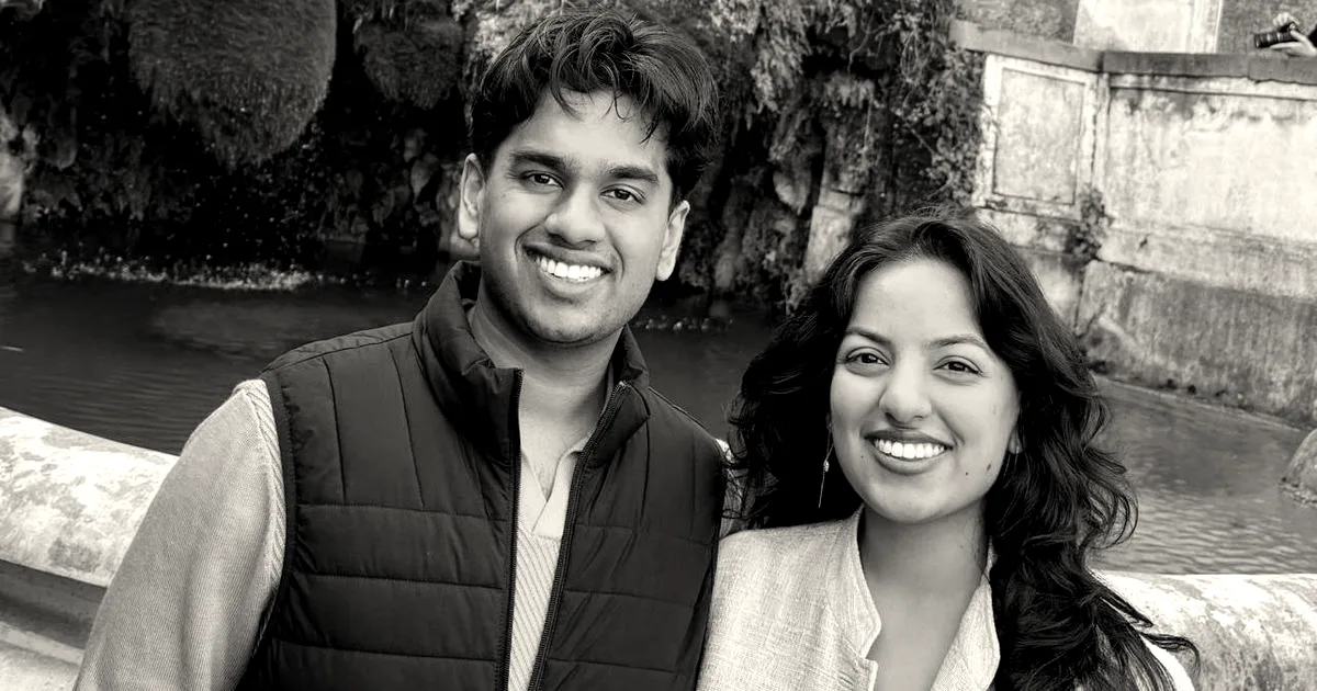 Circuit Breaker Labs founders Arul Nigam and Shirali Nigam smiling outdoors in front of a stone fountain.