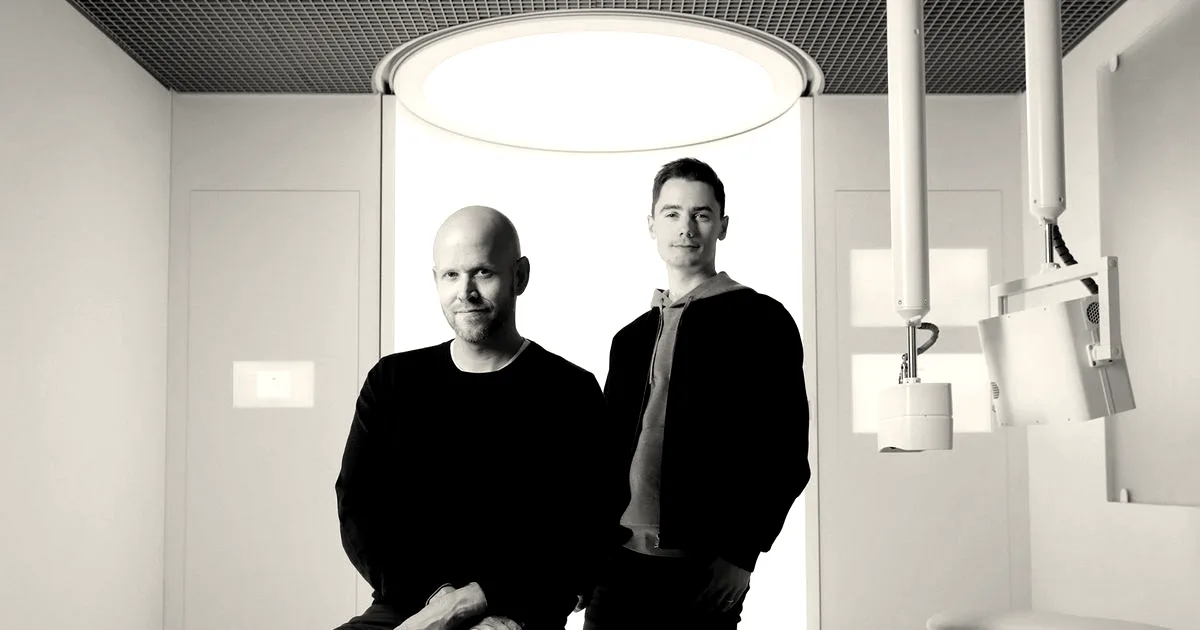Neko Health co-founders Daniel Ek and Hjalmar Nilsonne posing inside a medical scanning room.