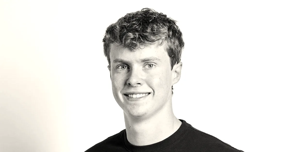 Ethan Thornton, founder and CEO of Mach Industries, smiling in a black shirt.