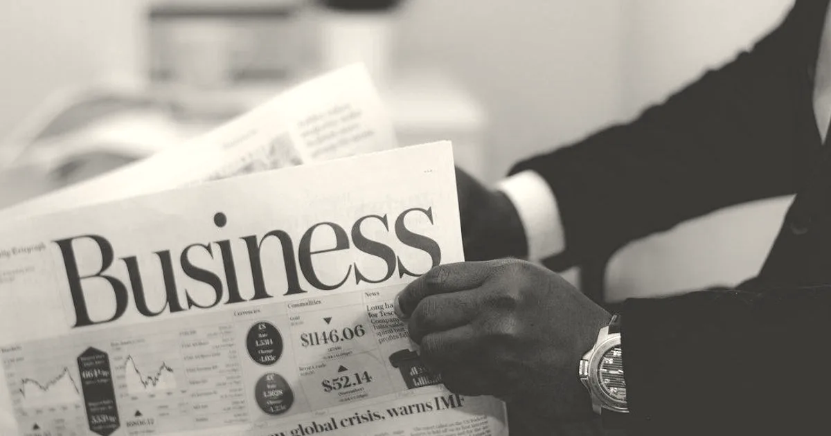Businessman opening a paper
