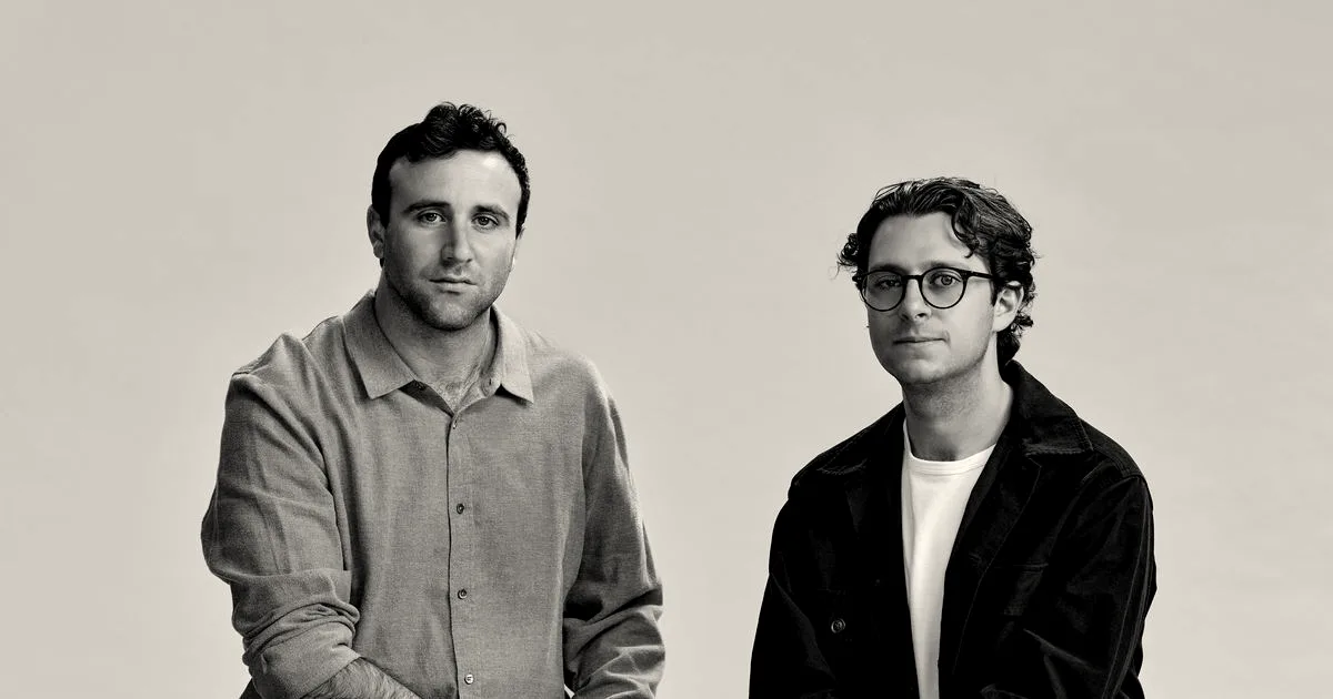 Portrait of Endeavor Optical Networks co-founders Charlie Horowitz and Tyler Presser seated against a neutral studio backdrop.