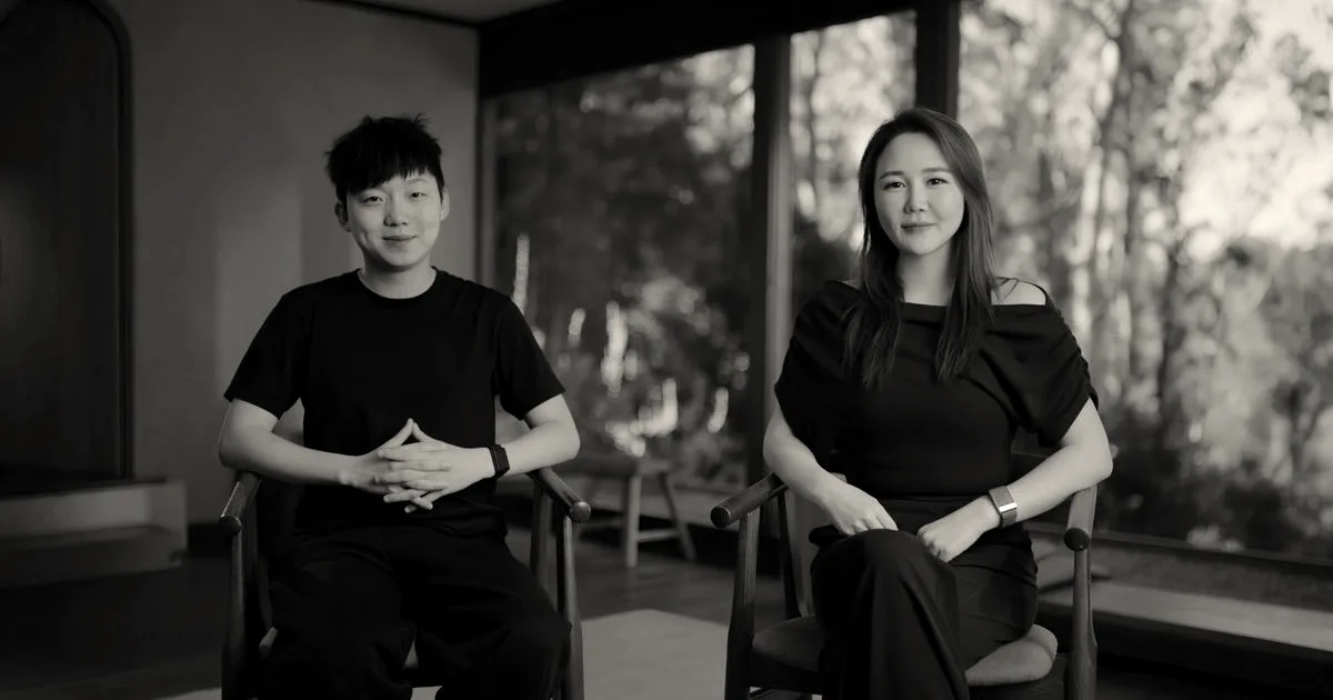 Fish Audio co-founders Shijia Liao and Rissa Cao sitting in chairs in front of a window.