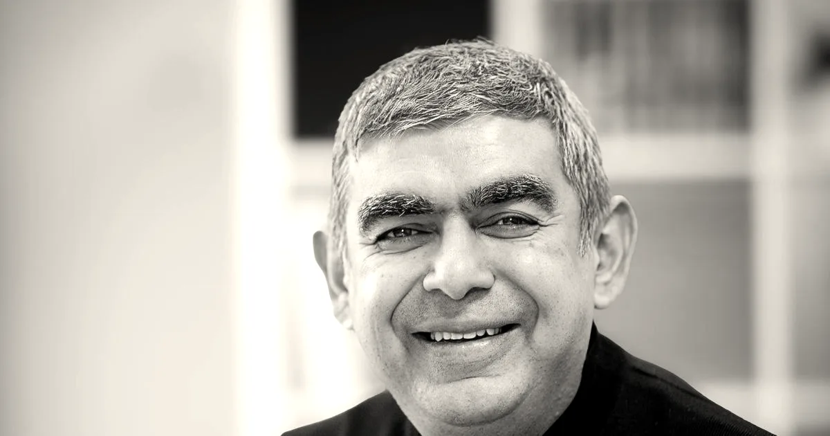 Close-up portrait of Vishal Sikka smiling and wearing a black turtleneck shirt.
