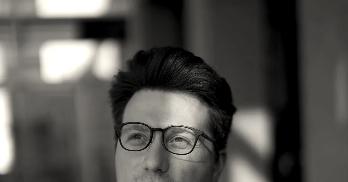 Portrait of Igor Babuschkin, founder of River AI, wearing glasses and a black shirt.