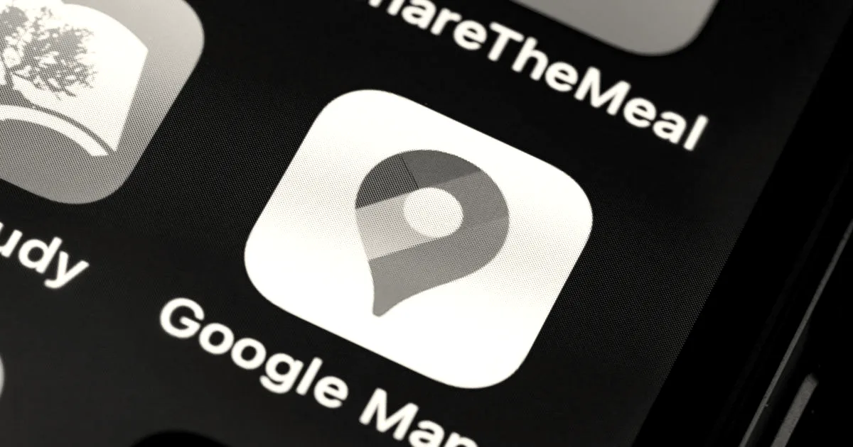 Close-up view of the colorful Google Maps pin icon displayed on a smartphone screen.