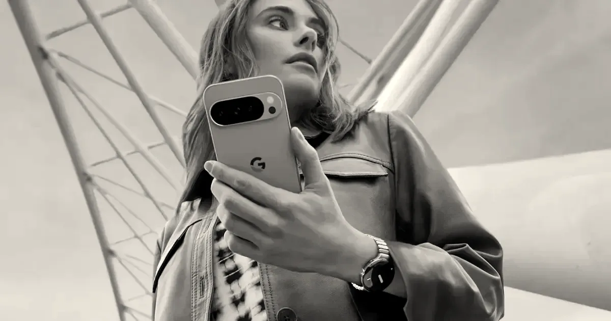 A woman holding a Google Pixel phone with the Google logo visible on the back.