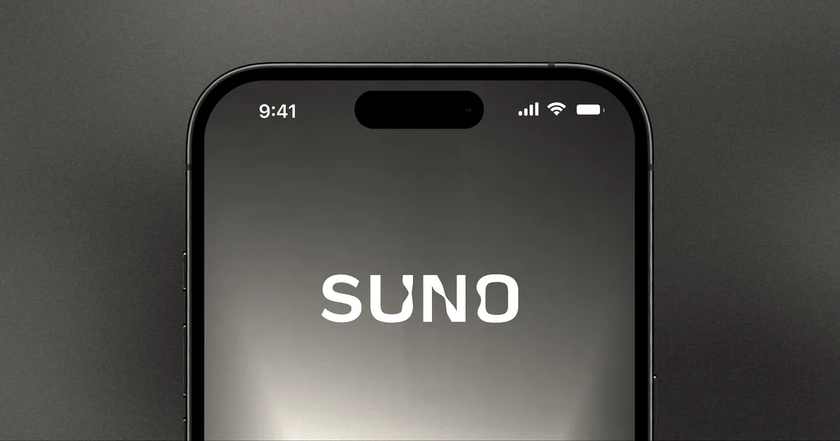 A close-up of a smartphone screen displaying the Suno logo against a warm gradient background.