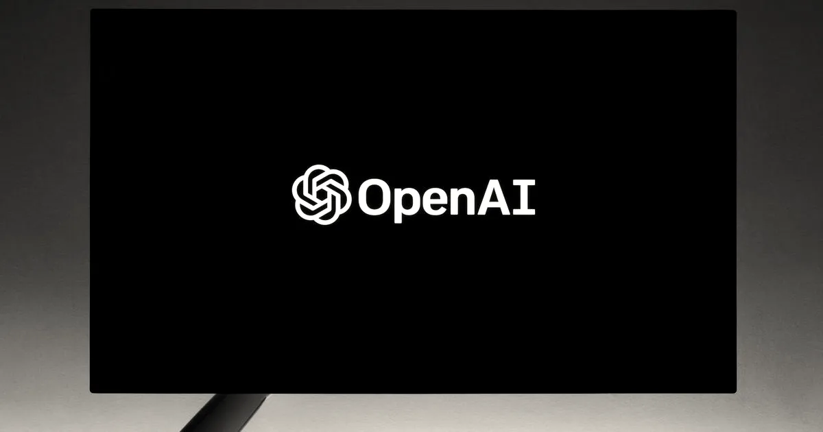 The OpenAI logo displayed in white text and icon on a black screen against a dark blue background.