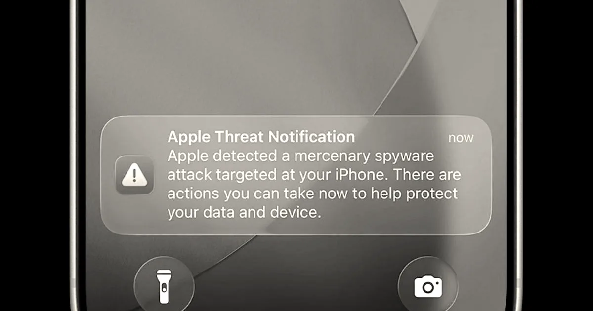 An iPhone lock screen displaying an official Apple Threat Notification warning about a mercenary spyware attack.