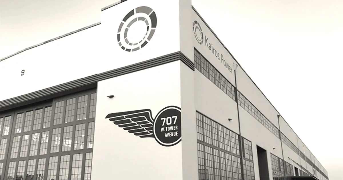 Exterior view of Kairos Power facility building featuring company logo and address under a clear sky.