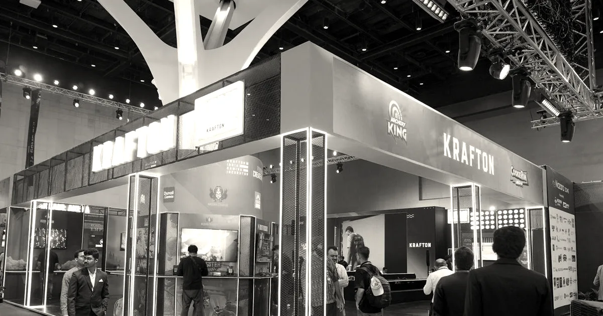 A busy gaming convention exhibition booth with bright illuminated signs reading KRAFTON.