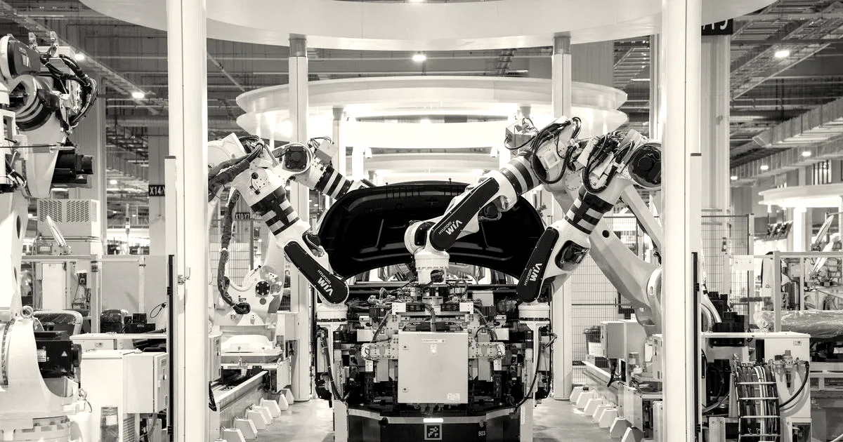 High-tech robots assembling a car in a modern factory setting, showcasing automation.
