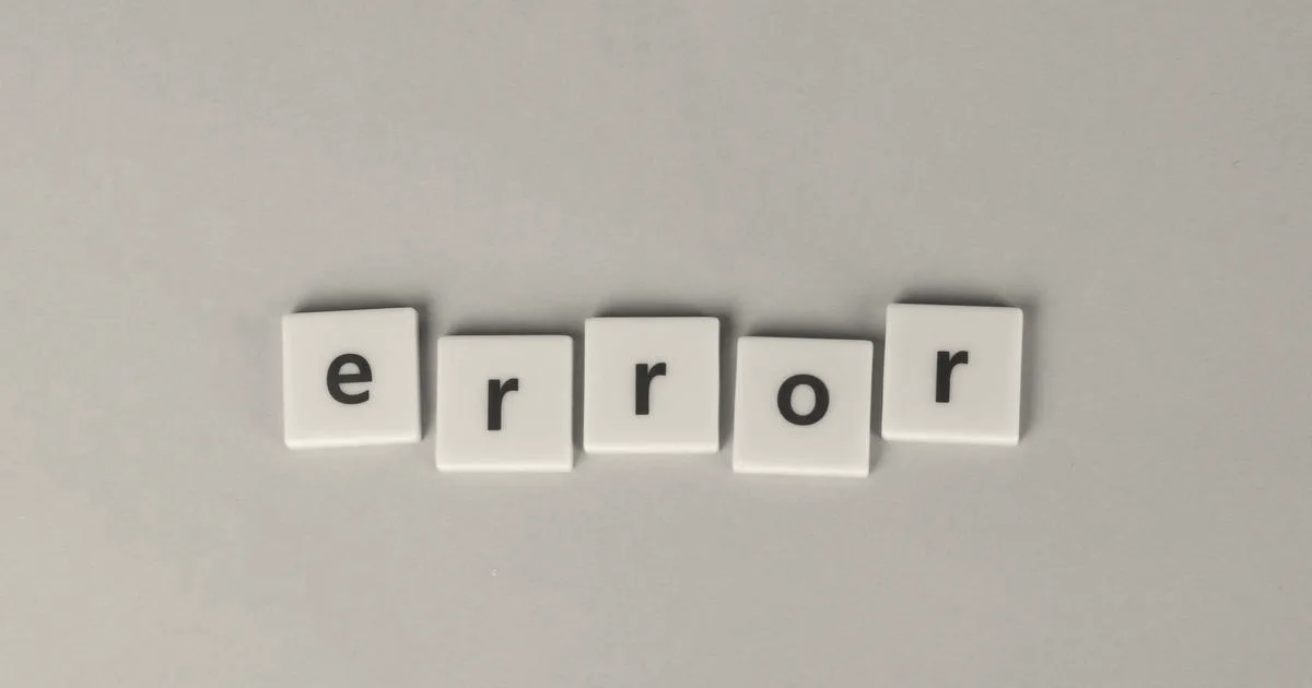 Yellow block letters spelling 'error' on a vibrant pink background, capturing a playful message.