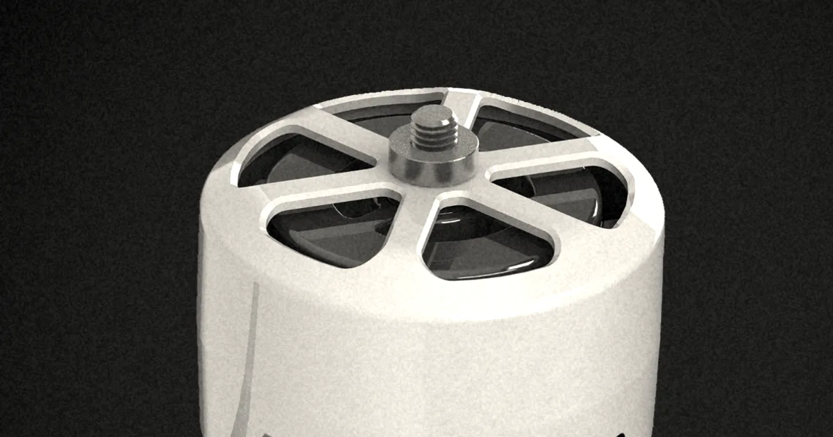A white and red compact electric motor by Modal Motors mounted on a dark background.