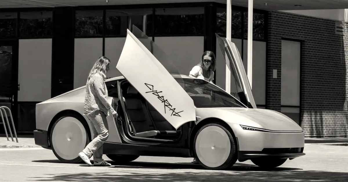 A gold Tesla Cybercab with butterfly doors open as two people stand beside it outdoors.