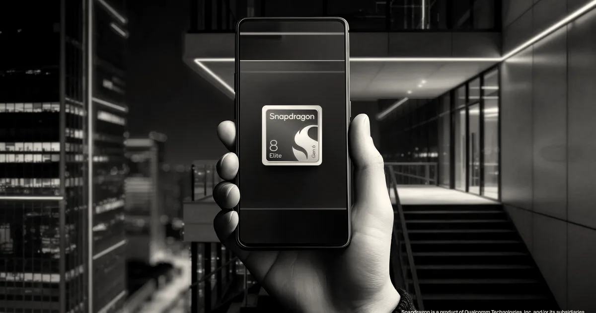 A hand holding a smartphone displaying a red Qualcomm Snapdragon 8 Elite logo against a red illuminated backdrop.