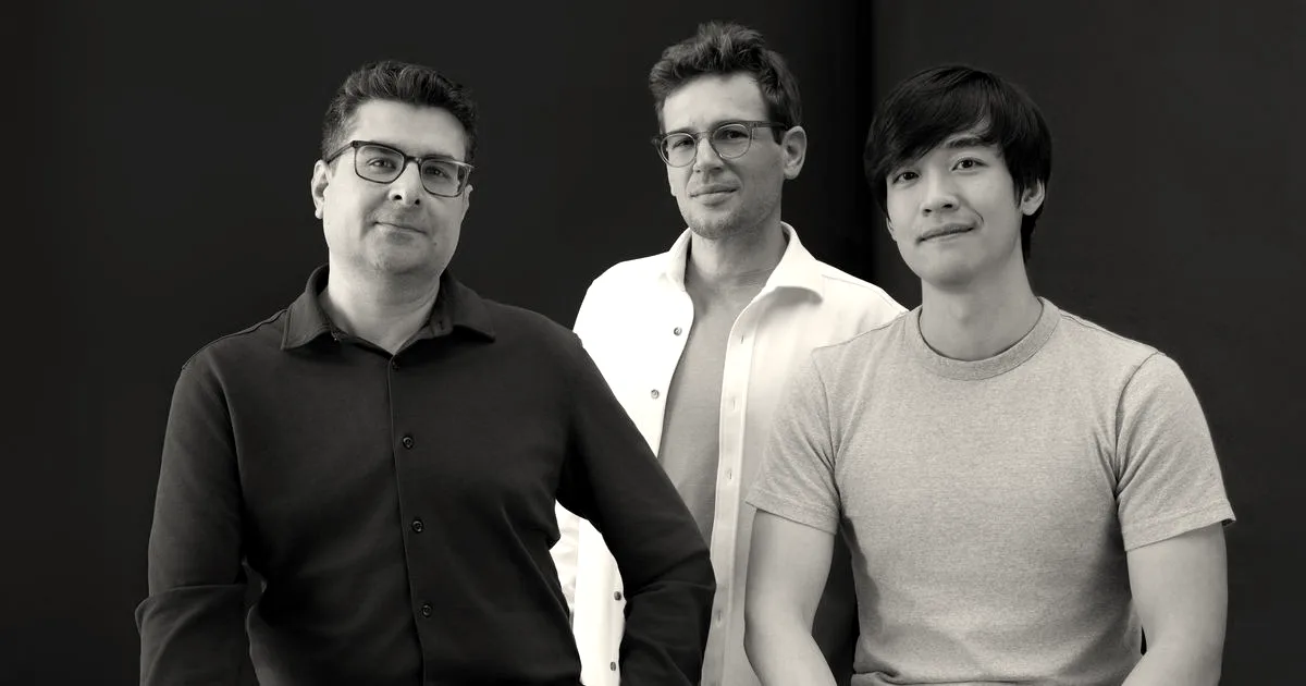 Three co-founders of QueryStory posing together against a blue and magenta background.