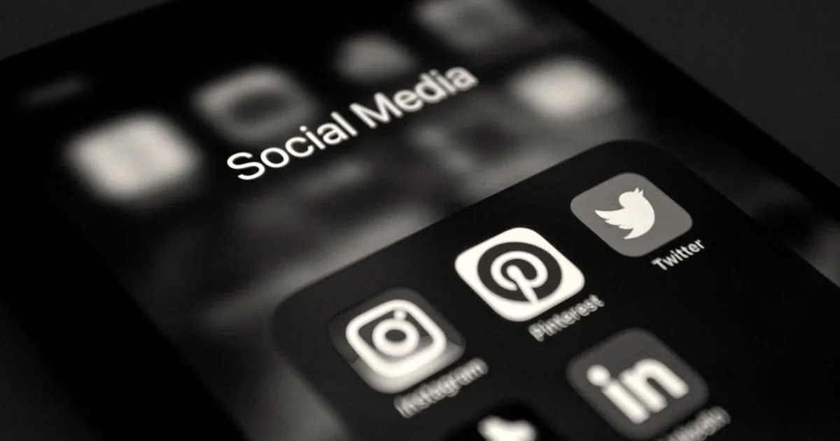 a close up of a cell phone with social media icons on it