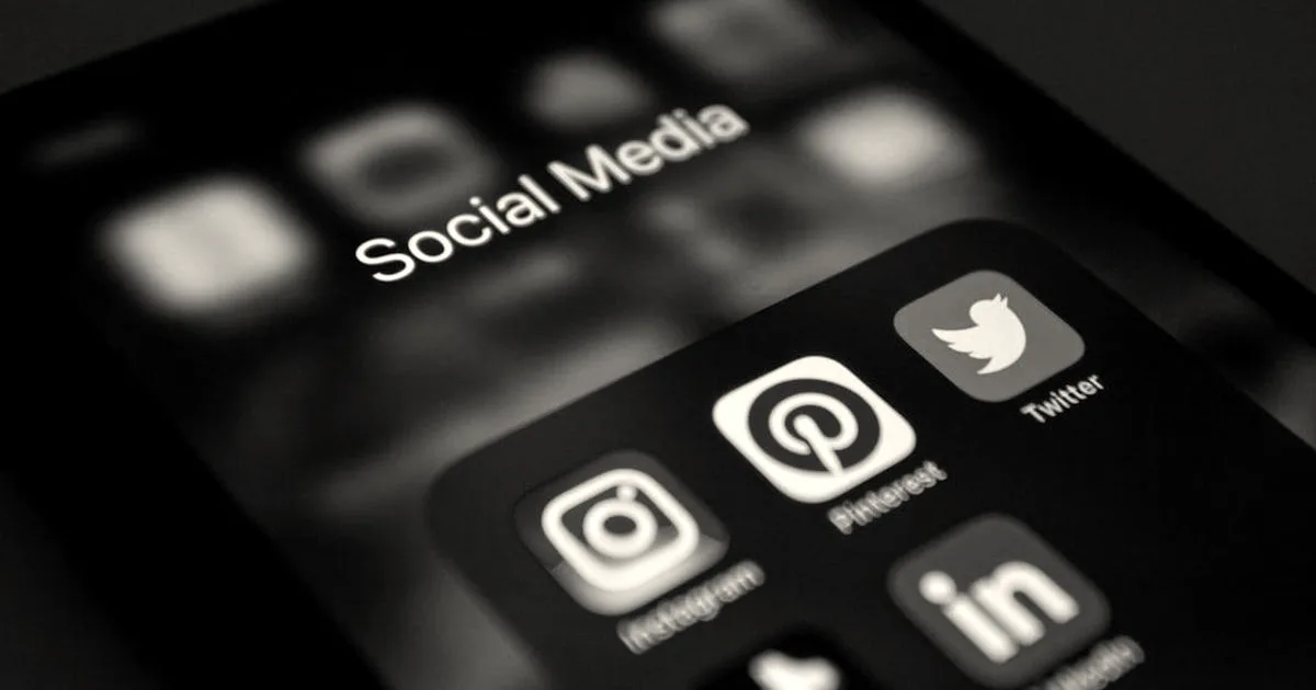 a close up of a cell phone with social media icons on it