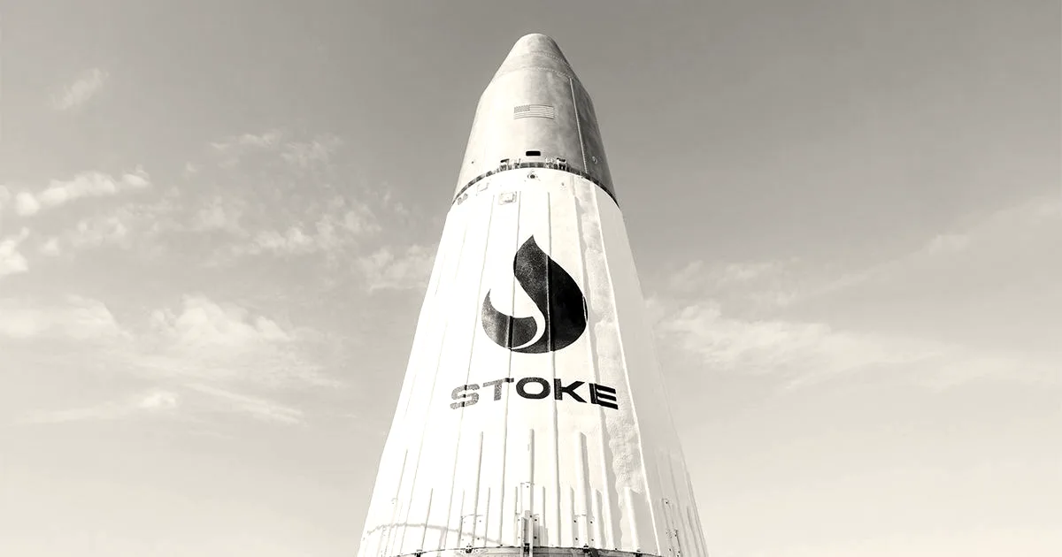 The white upper stage of Stoke Space's reusable rocket against a clear blue sky.