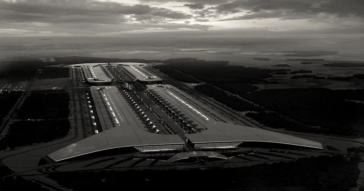 Aerial architectural concept rendering of the massive Terafab chip factory facility at dusk.