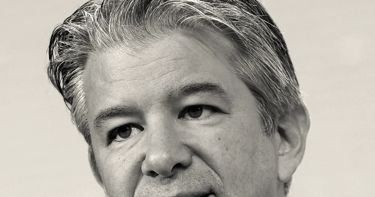 Close-up portrait of Travis Kalanick wearing a purple suit jacket and white open-collar shirt