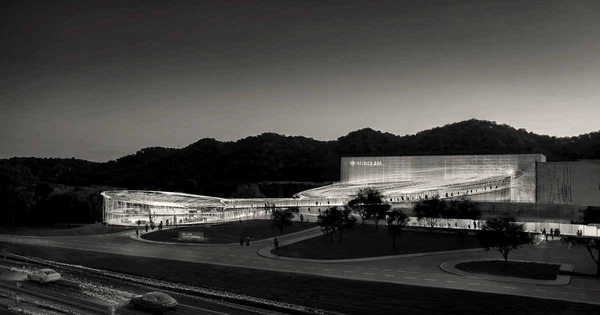 Architectural rendering of the Type One Energy Infinity One fusion facility at twilight with illuminated curved structures.