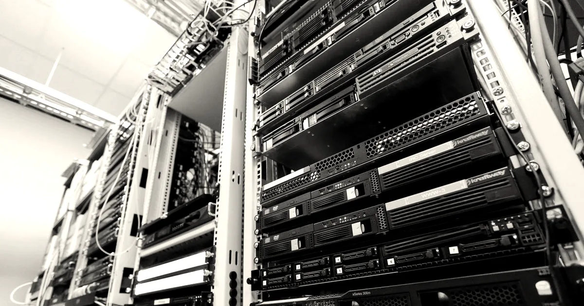 High-tech server rack in a secure data center with network cables and hardware components.